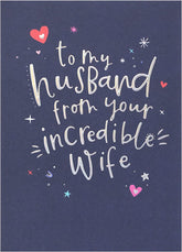 UK Greetings silver foil lettering husband birthday greeting card with elegant design and celebratory message.