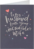 UK Greetings silver foil lettering husband birthday card with festive design and elegant details.