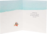 UK Greetings Snow Dogs Christmas Card featuring a festive winter scene with playful snow dogs and holiday decorations.