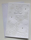 UK Greetings special couple die-cut luxury anniversary greeting card with pearls, celebrating love and congratulations.