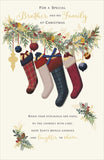 UK Greetings Christmas greeting card featuring stockings for brother and family, with festive holiday design.