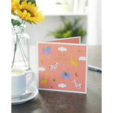 UK Greetings baby girl greeting card with sweet animal design, featuring colorful illustrations for new baby congratulations.