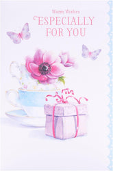 UK Greetings teacups design birthday greeting card featuring colorful teacup illustrations on a festive background.
