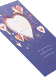 UK Greetings Valentine's Day card for husband with dark blue design, featuring romantic message and decorative elements