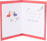 UK Greetings Valentine's Day card for husband featuring adorable dog illustrations and loving message in a charming design.
