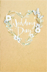 UK Greetings wedding greeting card for him, her, or friend featuring an elegant white flower design.