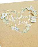 UK Greetings wedding greeting card for him, her, or friend featuring elegant white flower design and classic style.