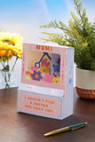 UK Greetings Mother's Day Card for Mum featuring an interactive teddy machine design, with colorful illustrations and heartfelt message.