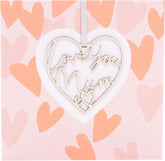 UK Greetings Mother's Day Card for Mum with keepsake heart attachment, featuring a heartfelt design for Mother's Day celebration.