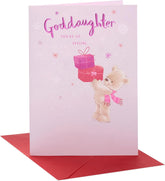 UK Greetings Christmas card for goddaughter featuring a teddy bear and presents, designed for festive holiday stationery.