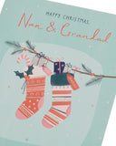 UK Greetings Nan & Grandad Christmas card featuring festive stockings, perfect for holiday greetings to grandparents.