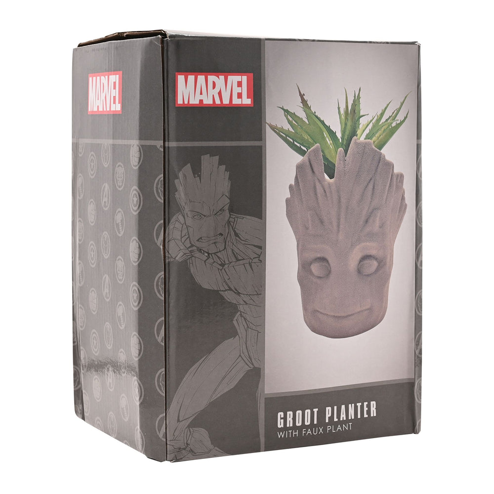 Marvel Groot planter with faux plant, featuring a detailed Groot figure holding a small decorative plant in a charming design.