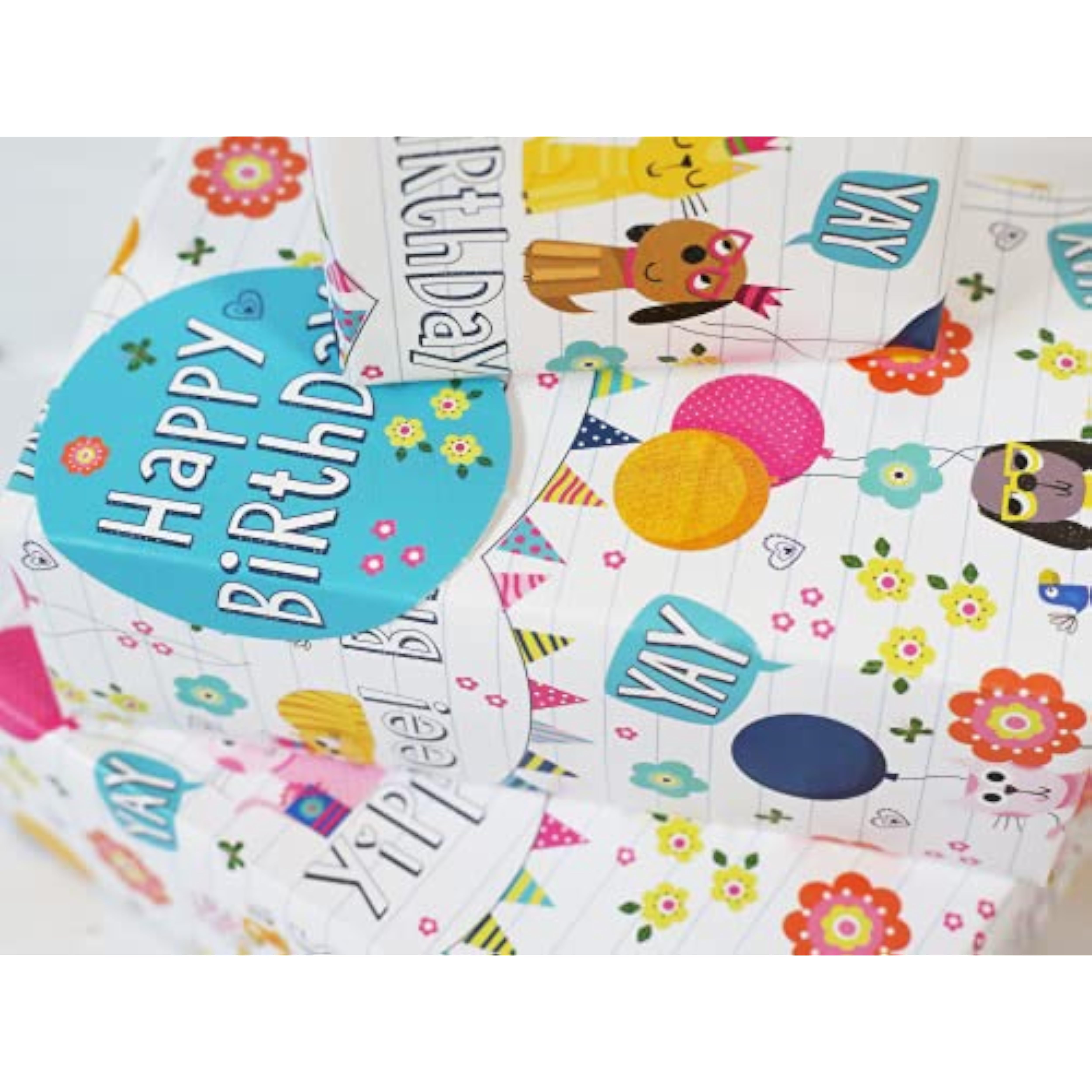 Abacus Cards birthday pets greeting card with colorful gift wrap sheets and matching tags, featuring playful animal illustrations.