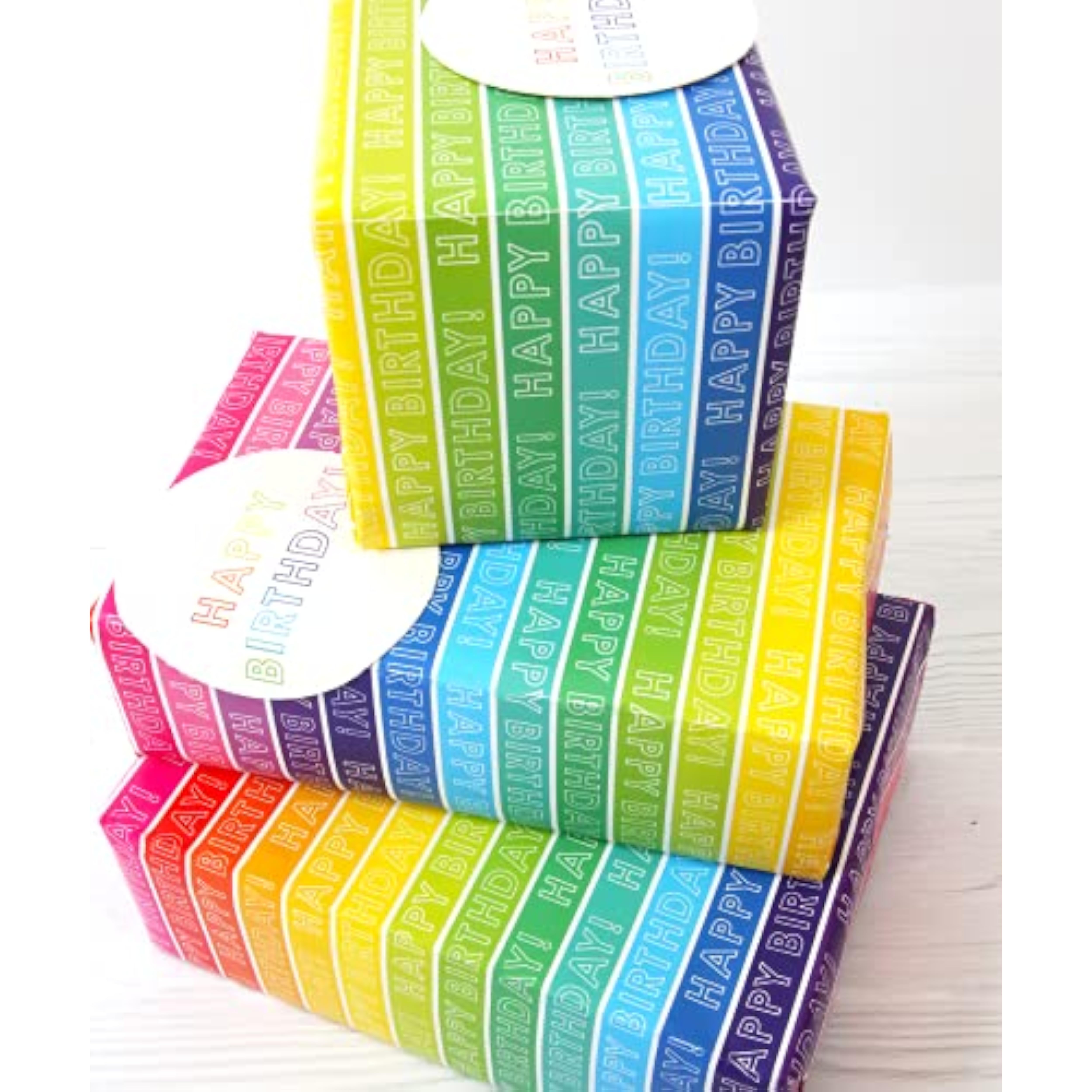 Bright rainbow-striped gift wrap with two sheets and matching tags from Abacus Cards, perfect for wrapping and greeting cards.