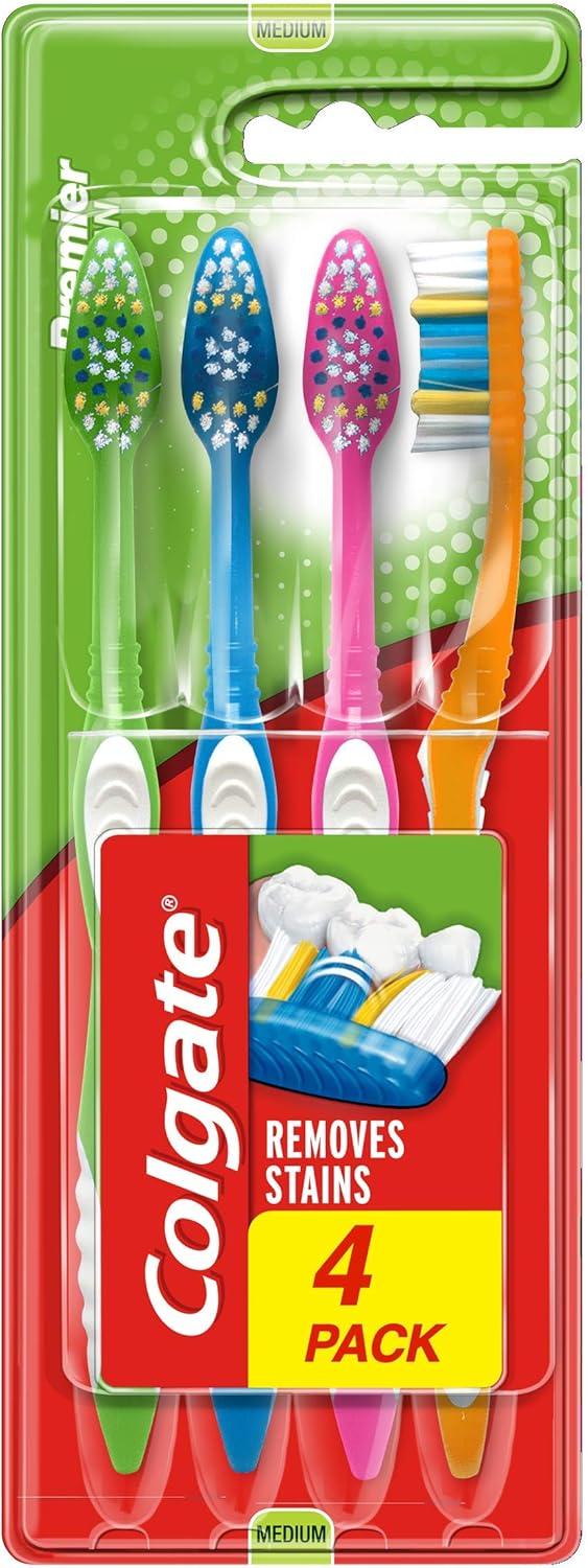 Set of four Colgate Premier Clean white toothbrushes for oral care in a 4-pack, designed for effective dental cleaning.