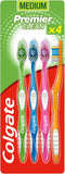A white Colgate Premier Clean toothbrush 4-pack for oral care, with soft bristles and ergonomic handles.