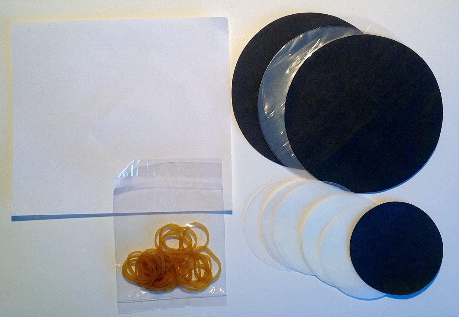 Pack of 20 County jam pot covers including wax discs, cellophane covers, and rubber bands for homemade preserves.