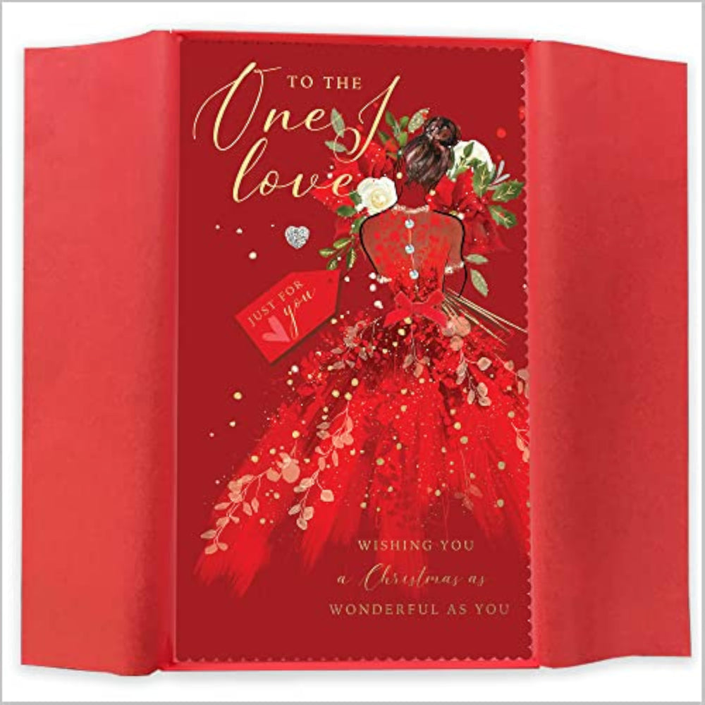 Festive Figure Holding Christmas Greeting Card with Seasonal Design and Warm Wishes