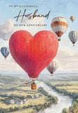 Romantic anniversary greeting card for husband featuring heart-shaped hot air balloon artwork by GBCC, perfect for special occasions.