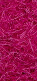 Glick Cerise shredded tissue paper for gift packaging, used as void fill and decorative accessory in gift boxes.