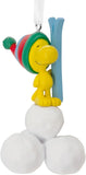 Hallmark Woodstock Peanuts resin Christmas tree ornament hanging on a decorated tree branch