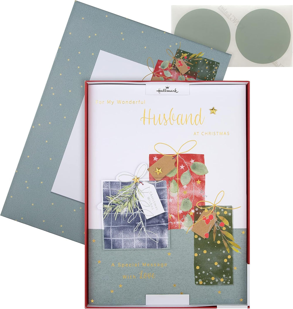 Hallmark boxed Christmas greeting card for husband featuring a traditional wrapped gifts design with festive holiday imagery.