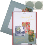 Hallmark boxed Christmas greeting card for husband featuring a traditional wrapped gifts design with festive holiday imagery.