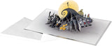 Hallmark Christmas card featuring The Nightmare Before Christmas with 3D pop-up design, gold foil accents, black and navy colors.