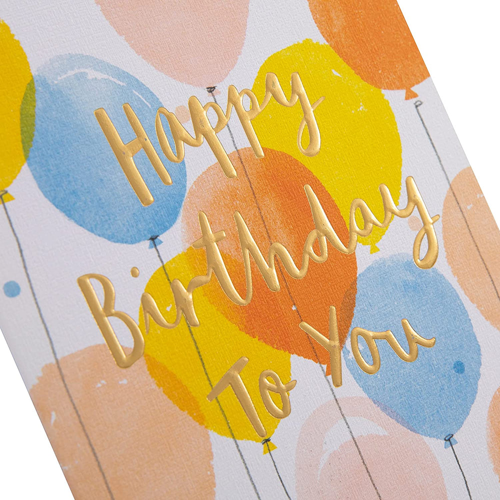 Hallmark embossed birthday greeting card with textured text design and colorful floral accents on the front.