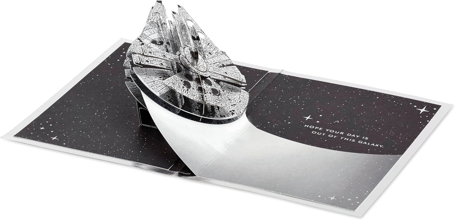 Hallmark 3D pop-up Star Wars Millennium Falcon space-themed silver birthday card with intricate design and vibrant details.