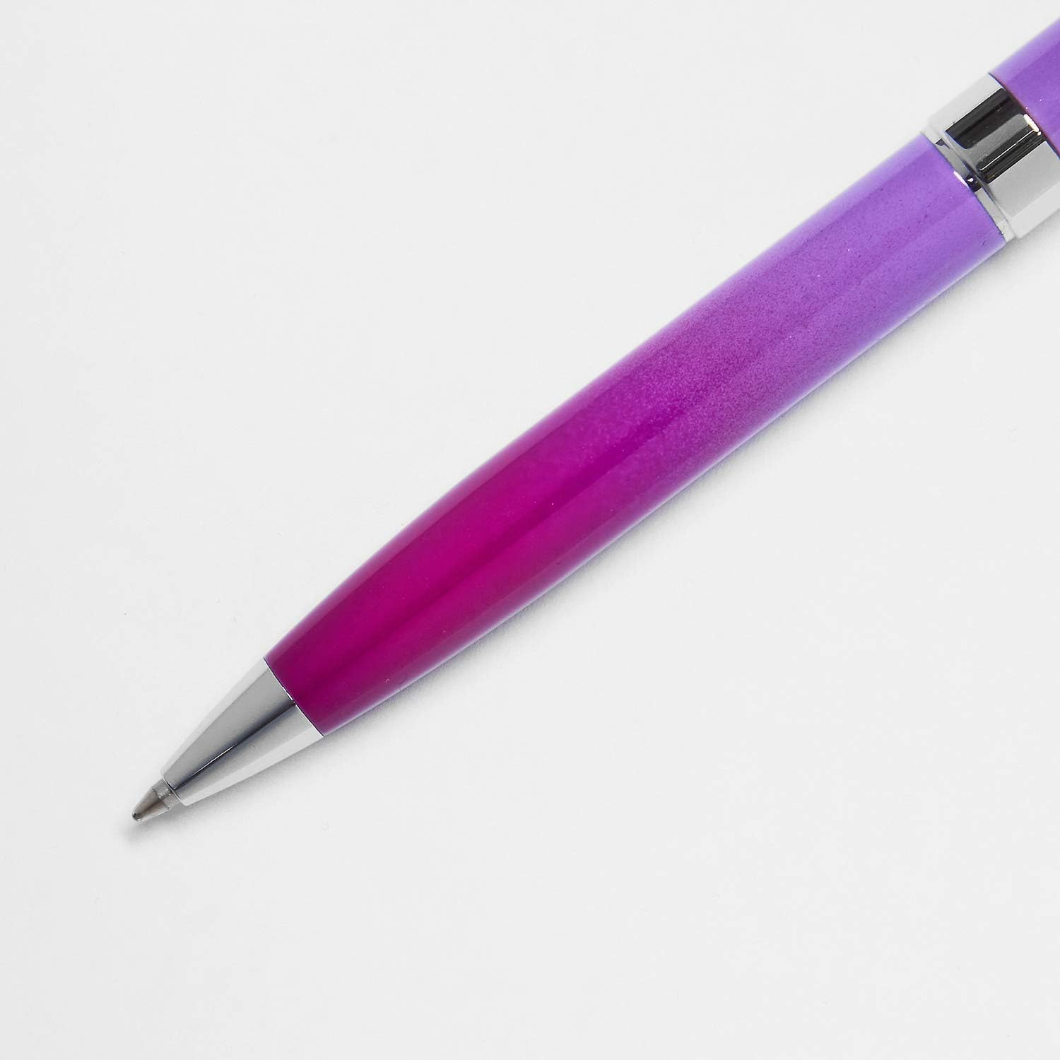 Helix Oxford Premium Ombre Pink ballpoint pen with blue ink, showcasing its stylish pink and blue gradient design.
