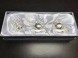 Silver keepsake box by Joe Davies featuring a Cinderella carriage design for storing first tooth and curl keepsakes.