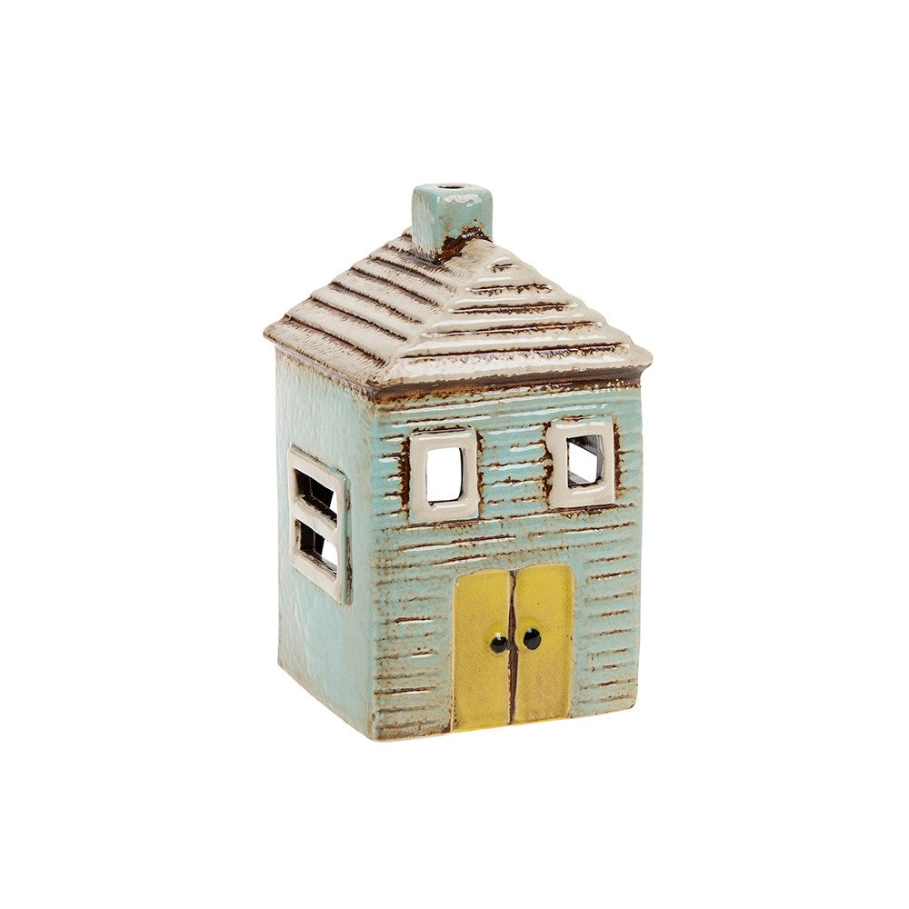Joe Davies Village Pottery blue house tealight holder with intricate village design and warm blue finish.