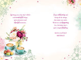 Kingfisher Sister-in-Law Happy Birthday greeting card with coffee and macaroons design, 9x6 inches, featuring colorful illustrations.