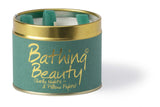 Lily-Flame Bathing Beauty scented tin candle for home fragrance, with floral design and warm glow.