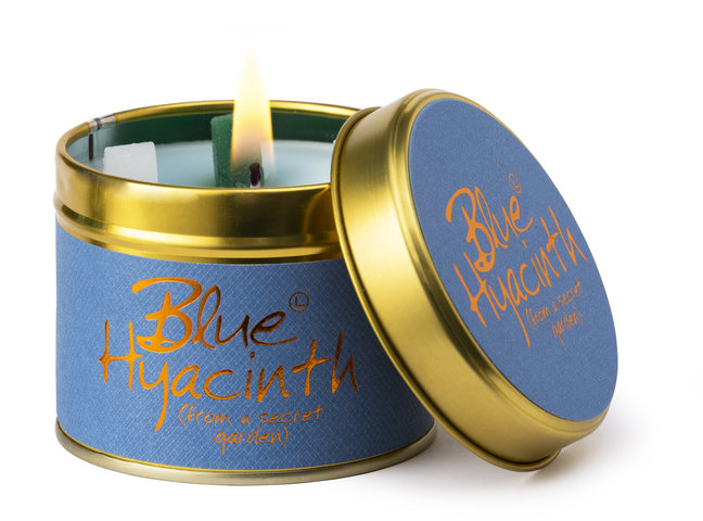 Blue Hyacinth scented tin candle by Lily-Flame, showcasing a decorative tin with a floral hyacinth design and a lit wick.