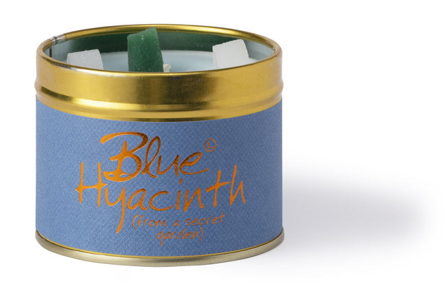 Lily-Flame Blue Hyacinth scented tin candle with a floral design and blue packaging, perfect for home fragrance.