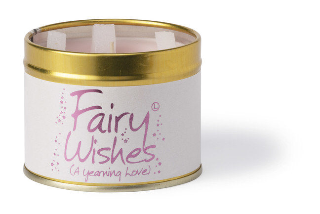 Lily-Flame Fairy Wishes scented tin candle with a whimsical fairy design and colorful label, perfect for creating a cozy ambiance.