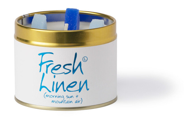 Lily-Flame Fresh Linen scented tin candle with a white label and metal lid, designed for home fragrance and cozy ambiance.
