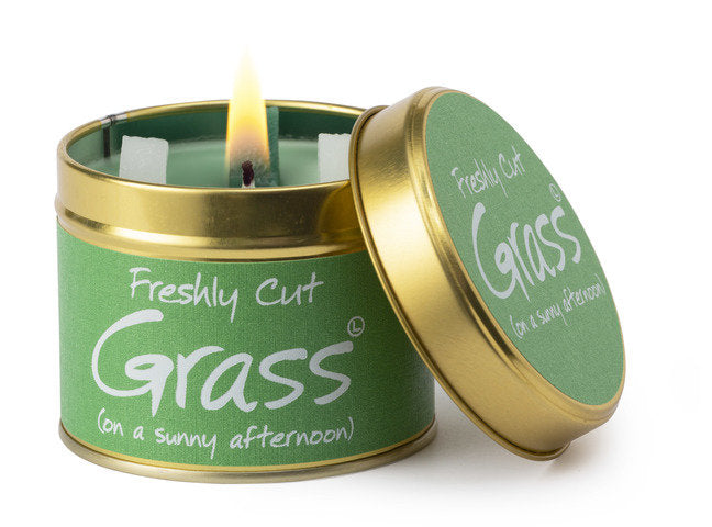 Lily-Flame Freshly Cut Grass scented tin candle with green label, showcasing a cozy candle design for home fragrance.