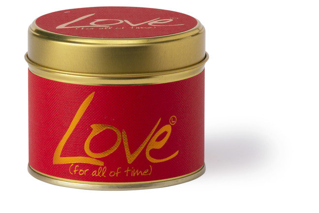 Lily-Flame Love scented tin candle with a decorative label, showcasing a cozy, handcrafted design perfect for home decor.