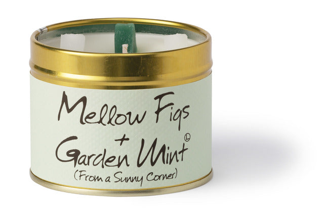 Lily-Flame scented tin candle with mellow figs and garden mint aroma, featuring a decorative label and silver lid.