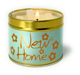 Lily-Flame New Home scented candle in a tin, featuring a decorative label and warm wax interior, perfect for home fragrance.