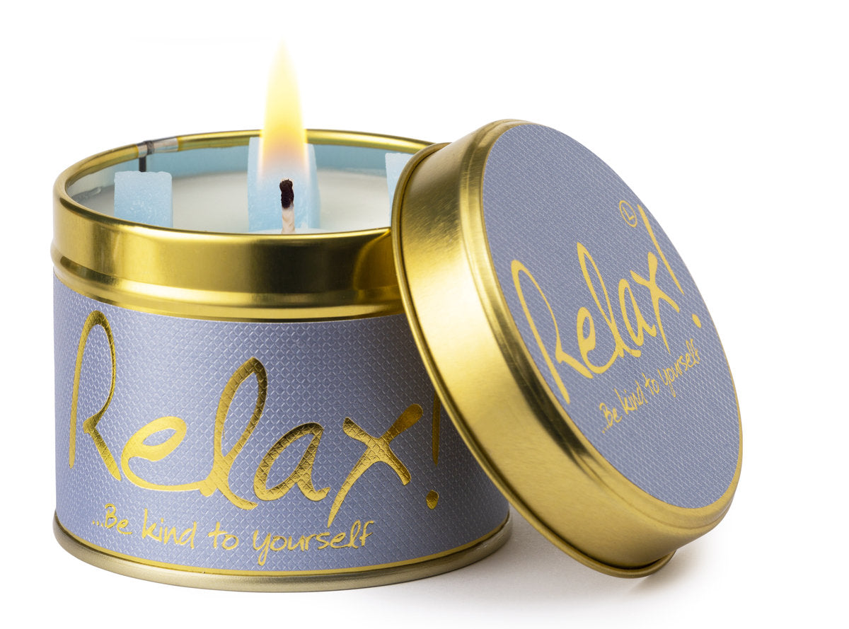 Lily-Flame Relax scented tin candle with a decorative label, designed for creating a calming ambiance.