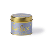 Lily-Flame Relax scented tin candle with a decorative label, designed for a calming ambiance and cozy setting.