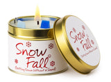 Lily-Flame Snow Fall scented tin candle with festive winter design and cozy fragrance in a small metal container.
