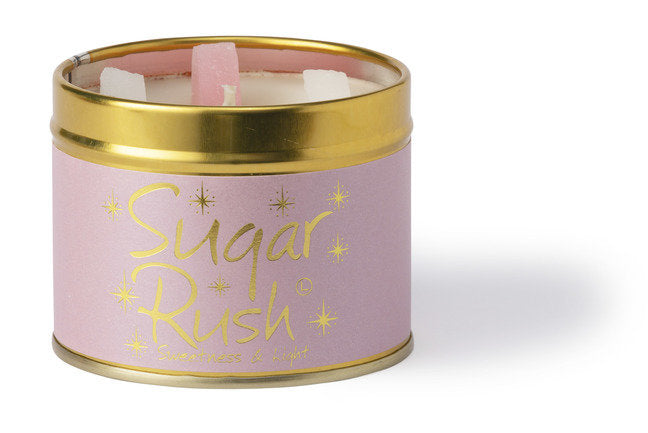 Lily-Flame Sugar Rush scented tin candle with a colorful, decorative label and a lit wick, designed for home fragrance.