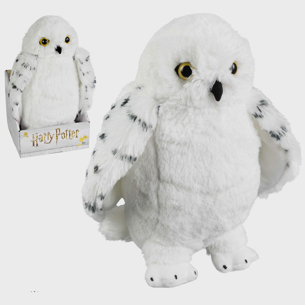 Noble Collection Harry Potter Hedwig soft plush snow owl toy with detailed white feathers and realistic features.