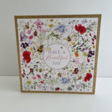 NQ Beautiful Day Wildflower Bloom birthday card with gold foil accents, featuring colorful wildflowers and elegant design.