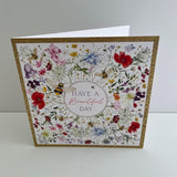 NQ Beautiful Day Wildflower Bloom birthday card with gold foil accents, featuring colorful wildflowers on a white background.